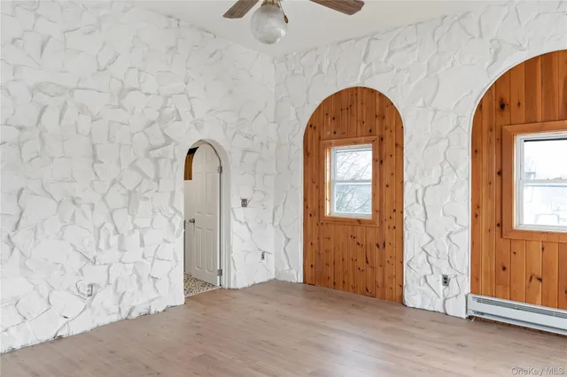 a view of front door with wooden floor