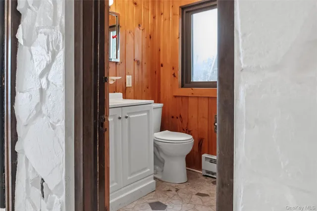 a bathroom with a mirror sink and vanity