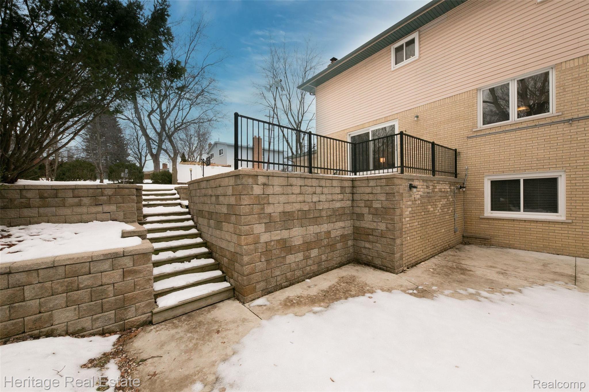 654 Old Perch Road Rochester, MI 48309 - Photo 50 of 61 Must-see large private backyard has huge patio space, beautiful hardscape, mature landscaping and backs to trees - a great place to enjoy nature, cook-outs and a game of catch
