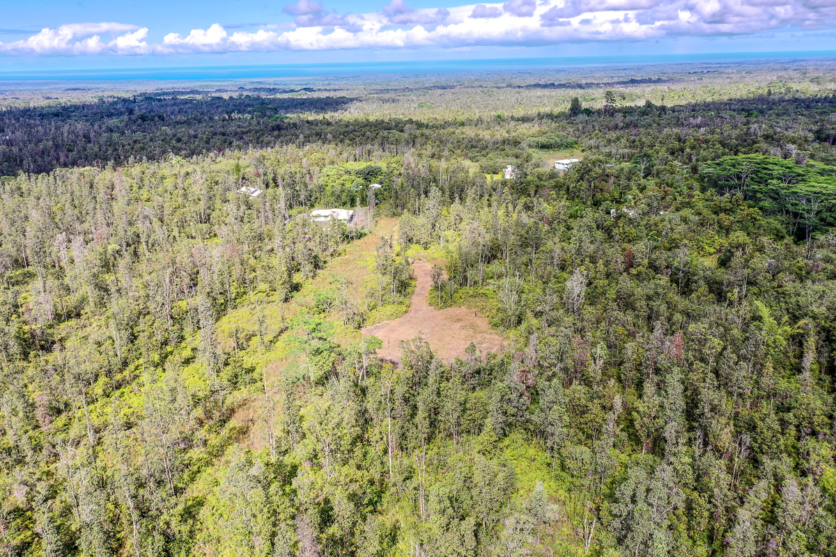 16-1474 Lot 3038 Hopue Rd Mountain View Mountain View, HI 96771 - Photo 23 of 30 a view of an ocean and a mountain