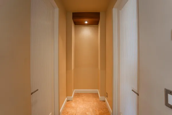 a view of a hallway with closet