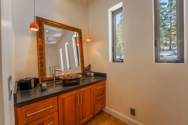 a bathroom with a sink and a mirror