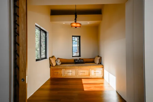 a bedroom with bed and window