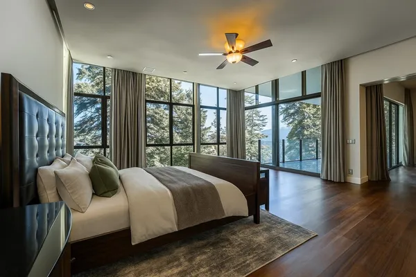 a bedroom with a bed and a chandelier