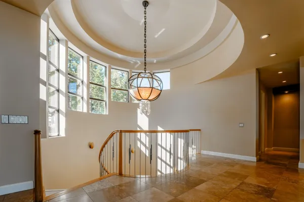 a view of entryway and hall with a chandelier