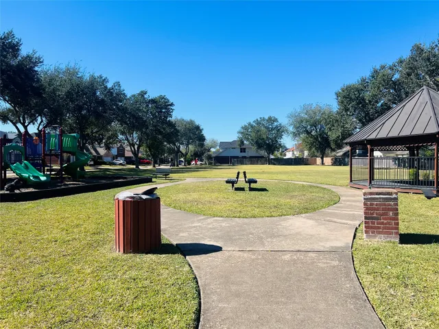 a view of a swimming pool with a yard
