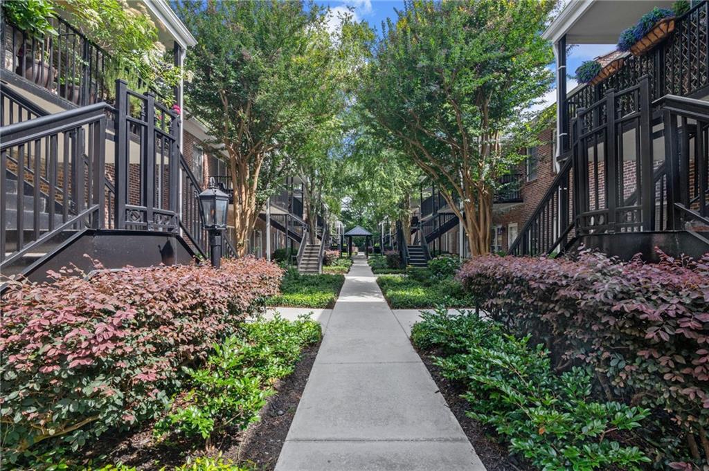 3675 Peachtree Road Northeast, Unit 45 Atlanta, GA 30319 - Photo 1 of 42 a view of a pathway with house on both side