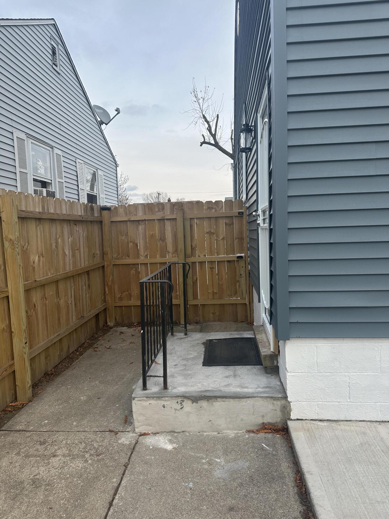 556 Gerry Street Gary, IN 46406 - Photo 19 of 21 a view of a street with wooden fence