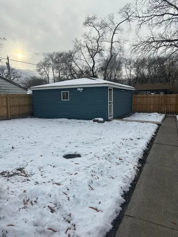 a view of roof with wooden fence