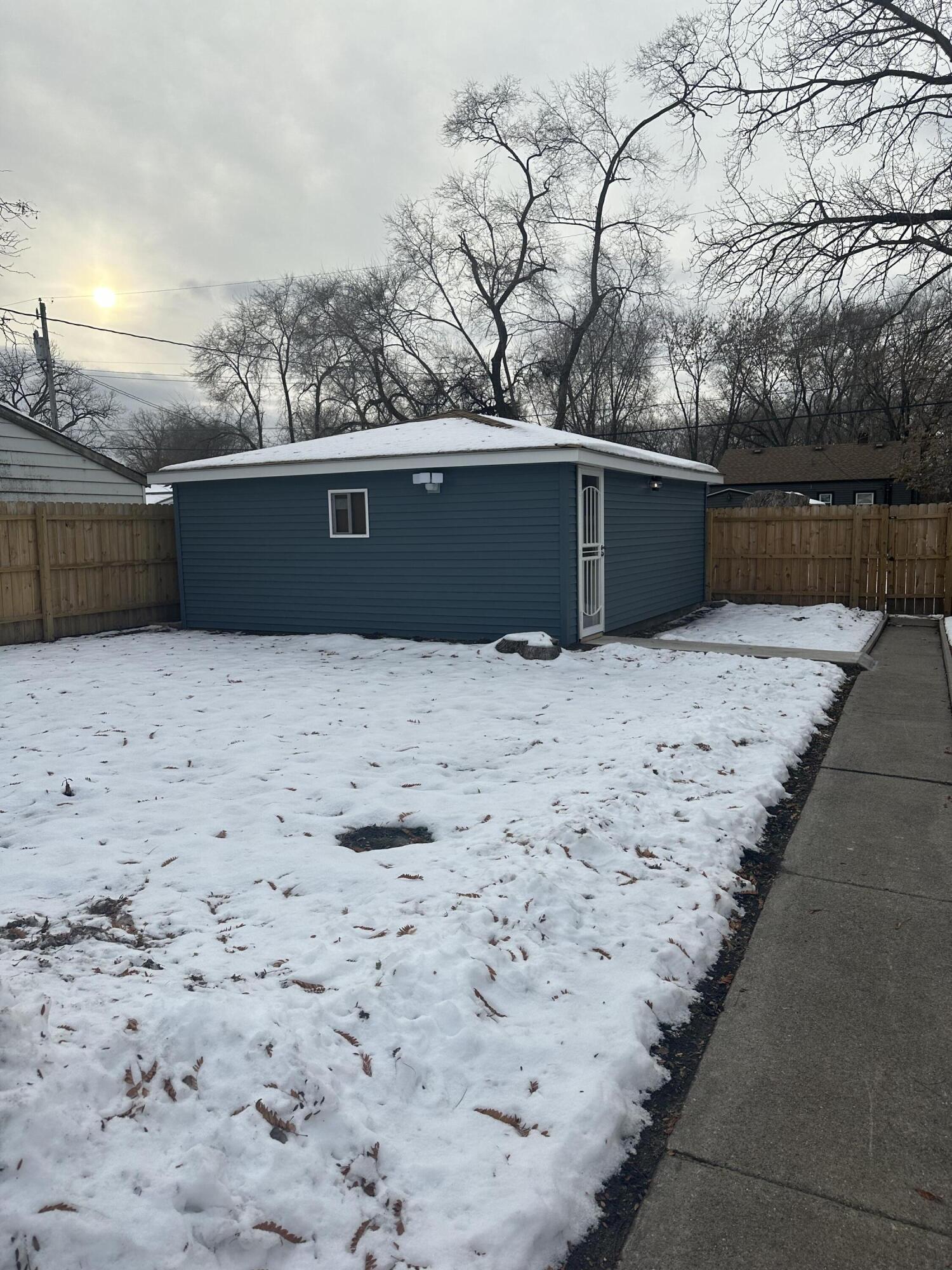556 Gerry Street Gary, IN 46406 - Photo 21 of 21 a view of roof with wooden fence
