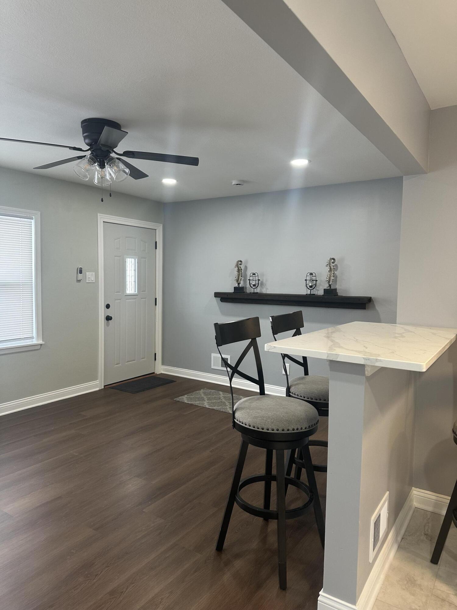556 Gerry Street Gary, IN 46406 - Photo 3 of 21 a view of a room with a table and chairs