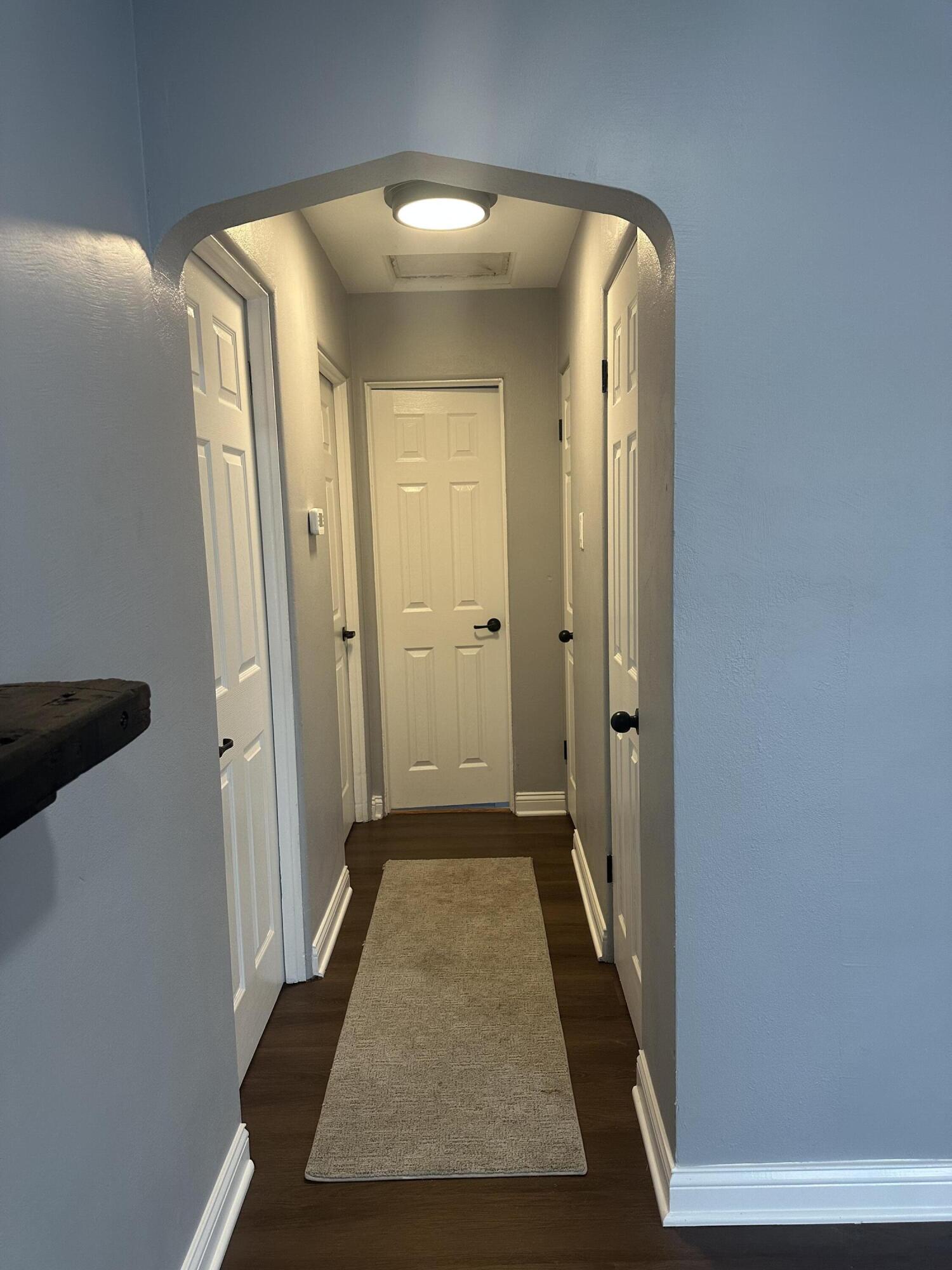 556 Gerry Street Gary, IN 46406 - Photo 7 of 21 view of a hallway with wooden floor and closet