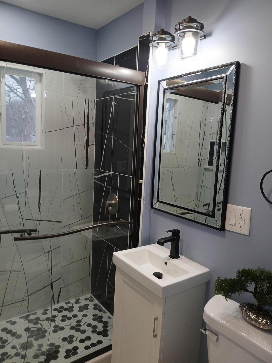 556 Gerry Street Gary, IN 46406 - Photo 8 of 21 a bathroom with a sink toilet and mirror