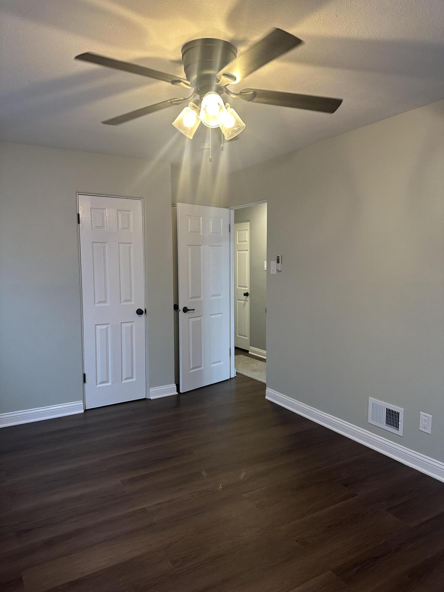556 Gerry Street Gary, IN 46406 - Photo 10 of 21 a view of an empty room with wooden floor