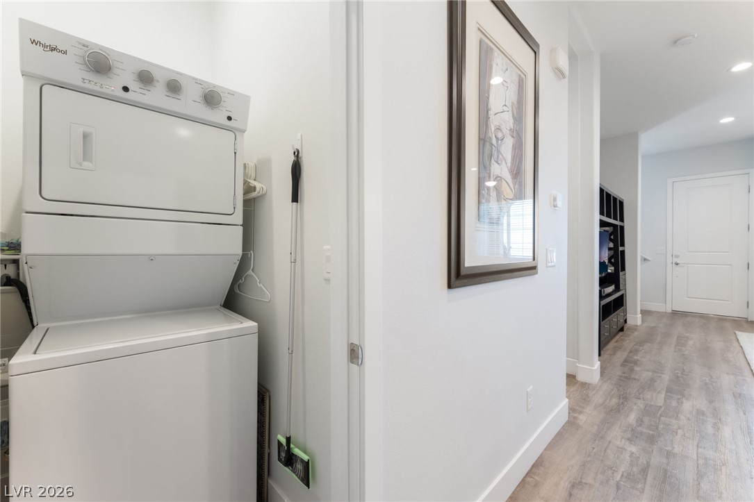 6432 Spring Jog Street Las Vegas, NV 89166 - Photo 36 of 61 Efficient laundry area with modern appliances offers convenience in a bright, streamlined space.