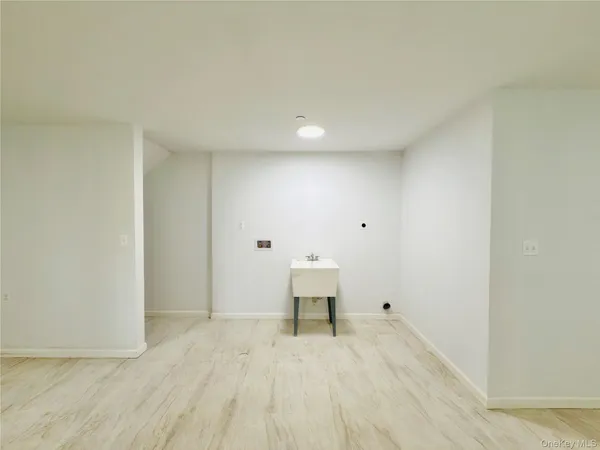 a view of room with wooden floor