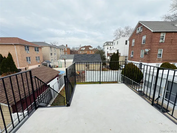 a view of a balcony and yard