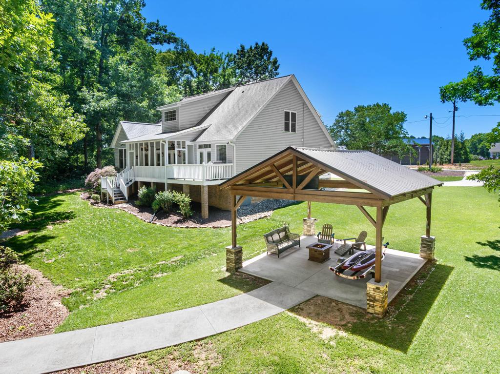 217 Maret Road Townville, SC 29689 - Photo 6 of 35 An inviting backyard oasis offers a covered patio ideal for relaxation and entertaining.