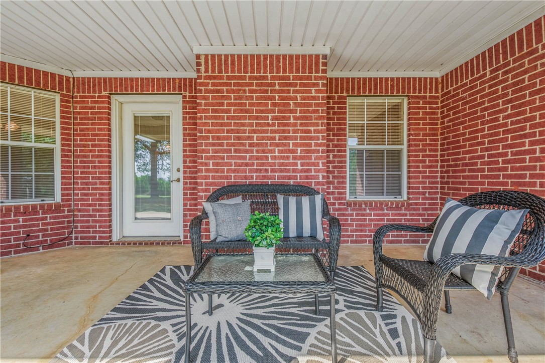 1110 County Road 439 Dime Box, TX 77853 - Photo 39 of 50 a view of balcony with two chairs and a barbeque