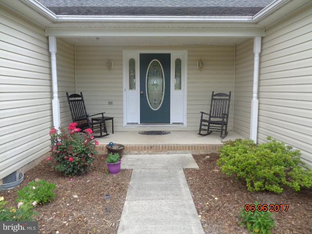 719 Quarry Road Bunker Hill, WV 25413 - Photo 2 of 30 FRONT PORCH WITH BEAUTIFUL LANDSCAPING