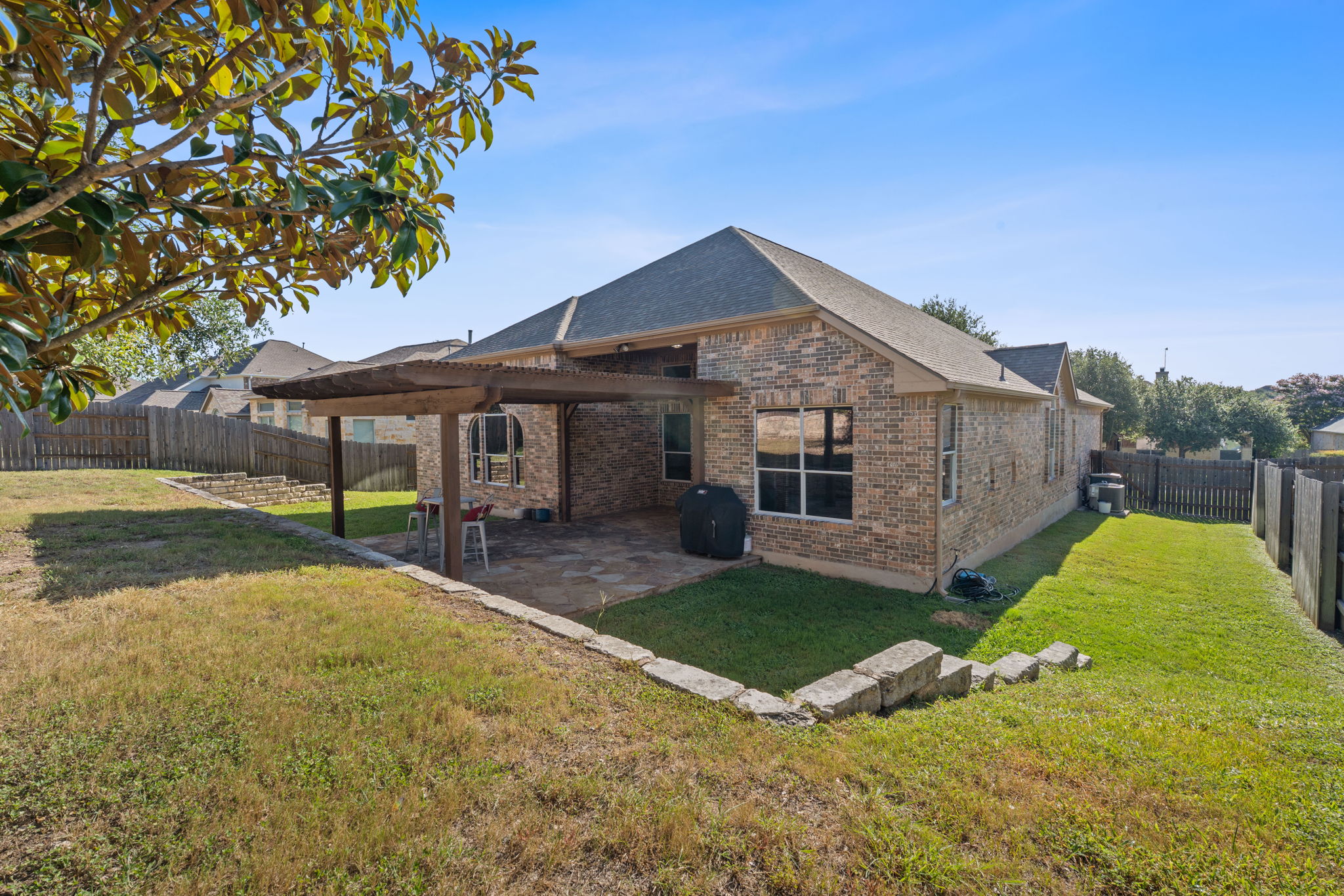 185 Mountain Laurel Way Austin, TX 78737 - Photo 25 of 33 a view of a house with a yard