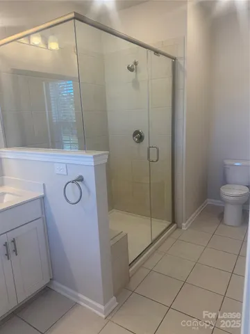 a bathroom with a shower and a sink