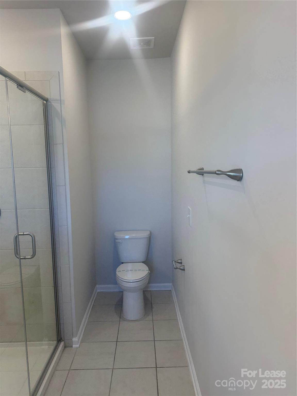 10016 Hemingway Place, Unit 22 Mint Hill, NC 28227 - Photo 13 of 16 a bathroom with a toilet and a shower