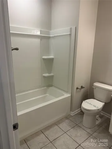 a bathroom with a sink a toilet and a bathtub