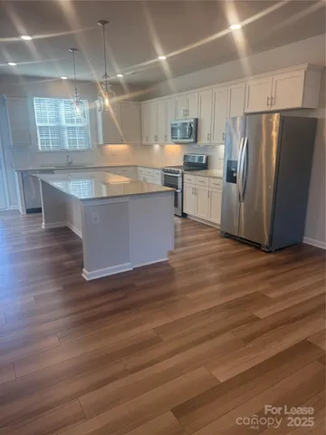 a view wooden kitchen and refrigerator