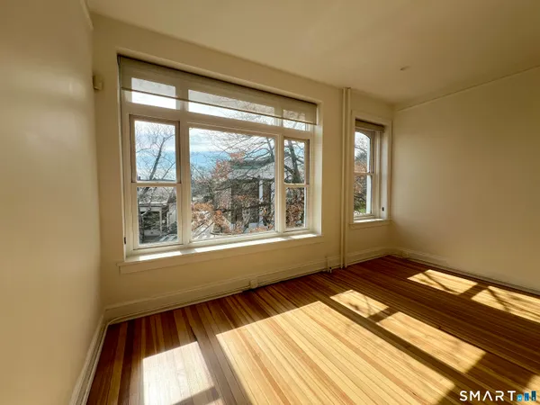 a view of an empty room with a window