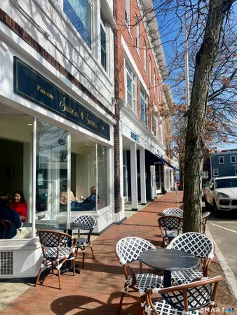 a outdoor space with a table and chairs