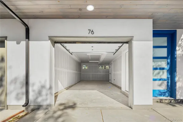 a view of a hallway with a white walls