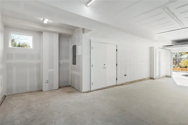 a view of an empty room and a window