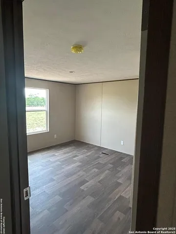 a white toilet sitting next to a small sink