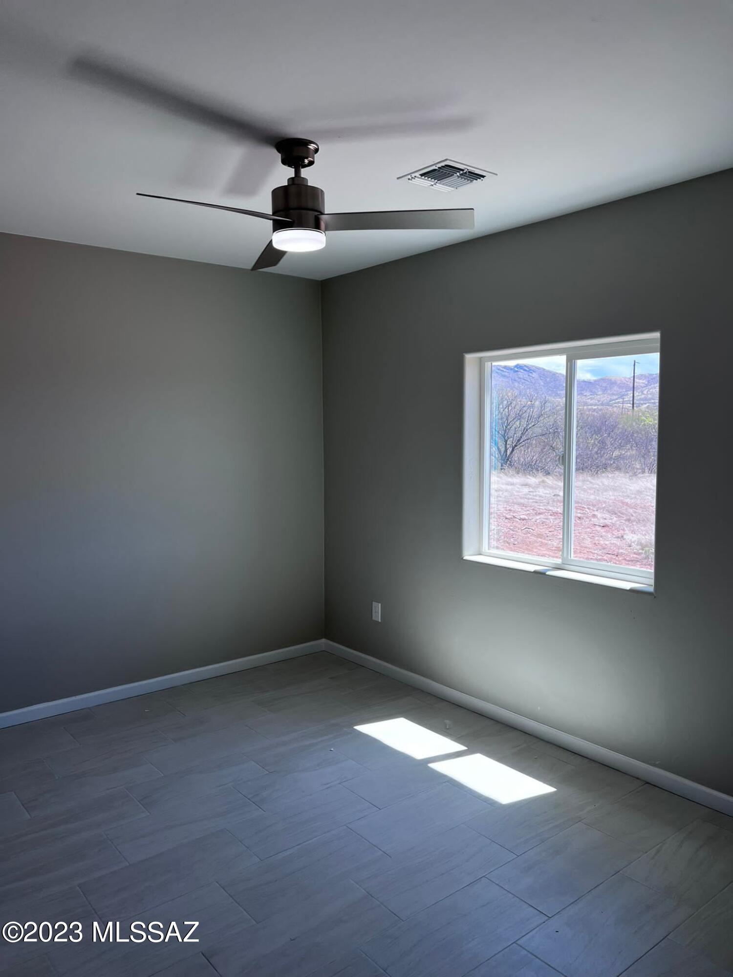 1792 Portugal Court Rio Rico, AZ 85648 - Photo 10 of 14 an empty room with a window