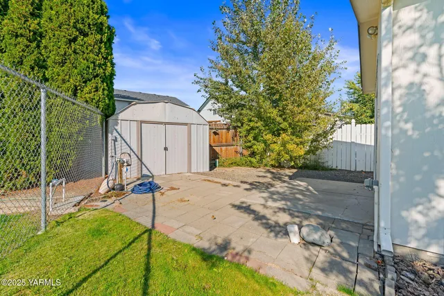 a view of a kitchen with furniture and cabinets
