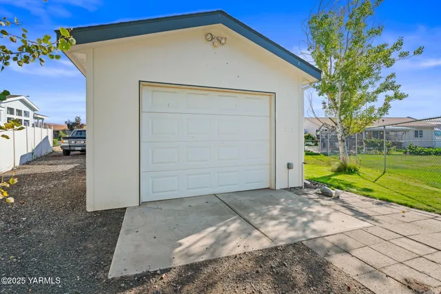 a view of house with outdoor space and parking