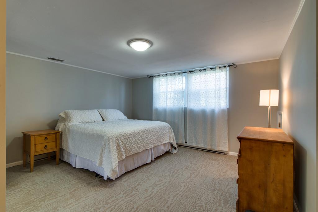 5019 Chaffin Drive Nashville, TN 37221 - Photo 19 of 30 a spacious bedroom with a bed and a window