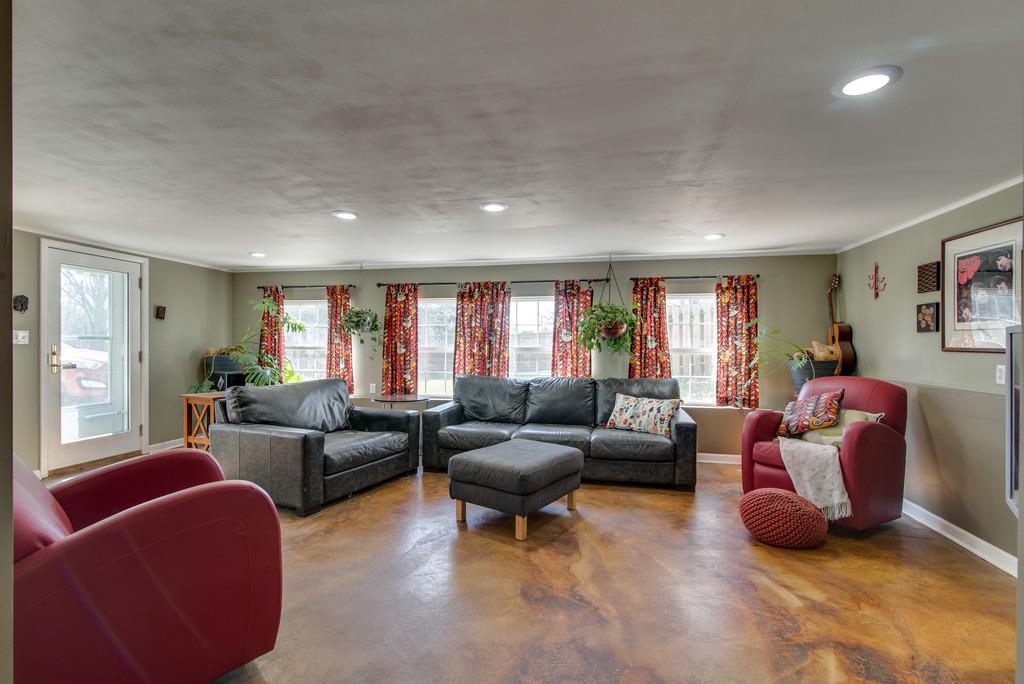 5019 Chaffin Drive Nashville, TN 37221 - Photo 24 of 30 a living room with furniture and a window