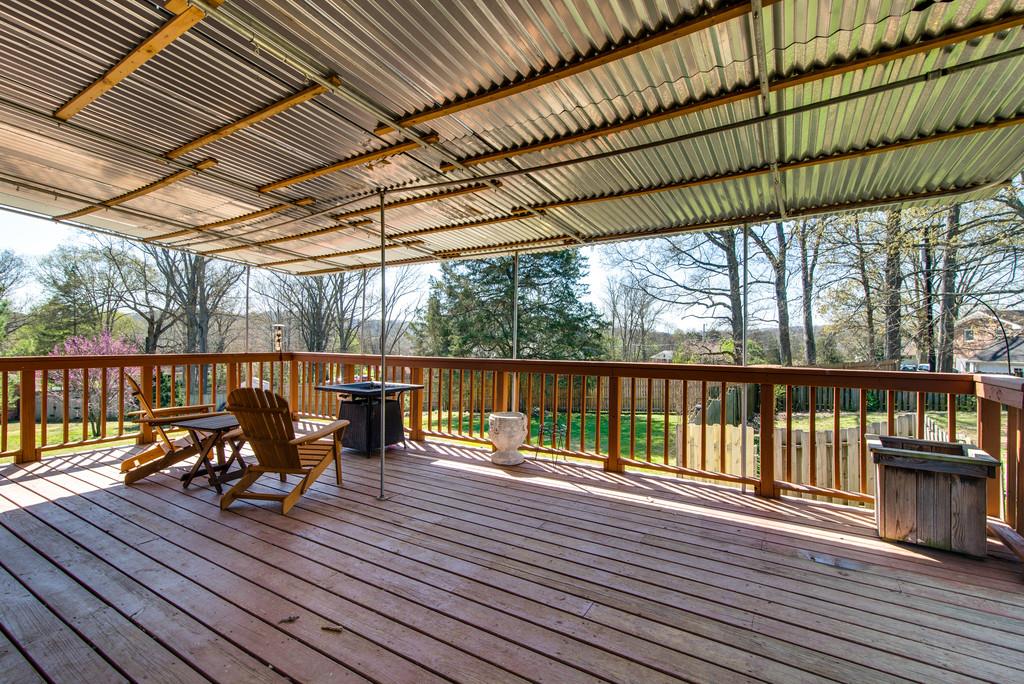 5019 Chaffin Drive Nashville, TN 37221 - Photo 26 of 30 a view of deck with table and chairs a barbeque with wooden floor
