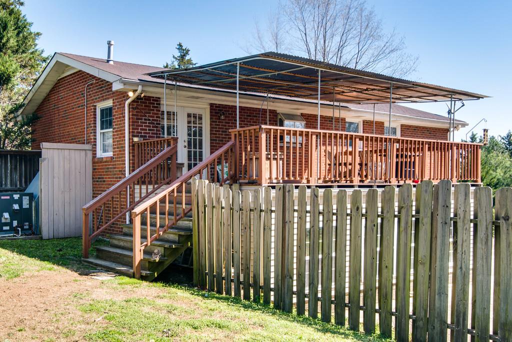 5019 Chaffin Drive Nashville, TN 37221 - Photo 29 of 30 a view of a house with wooden fence