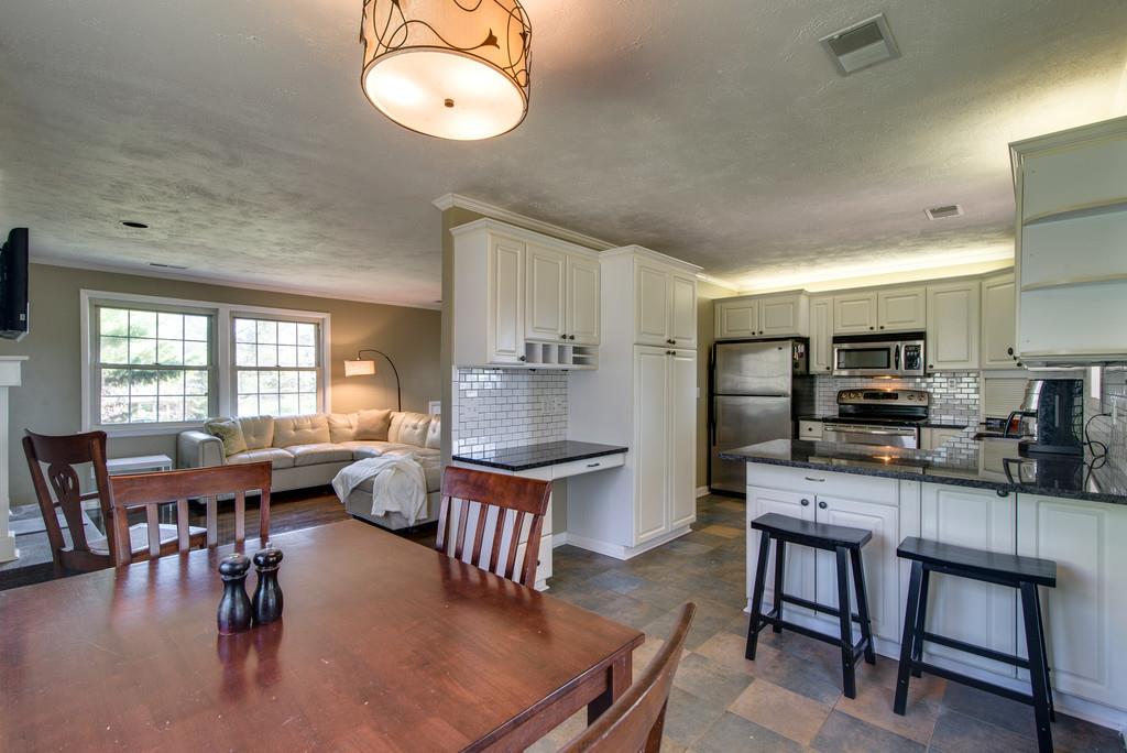 5019 Chaffin Drive Nashville, TN 37221 - Photo 7 of 30 a very nice looking kitchen with furniture and a large window