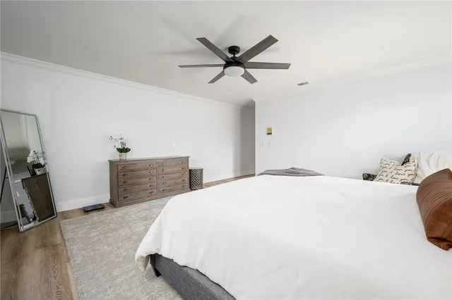 a bedroom with a bed and a desk