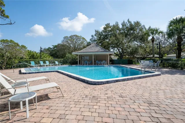 a view of a swimming pool with a patio
