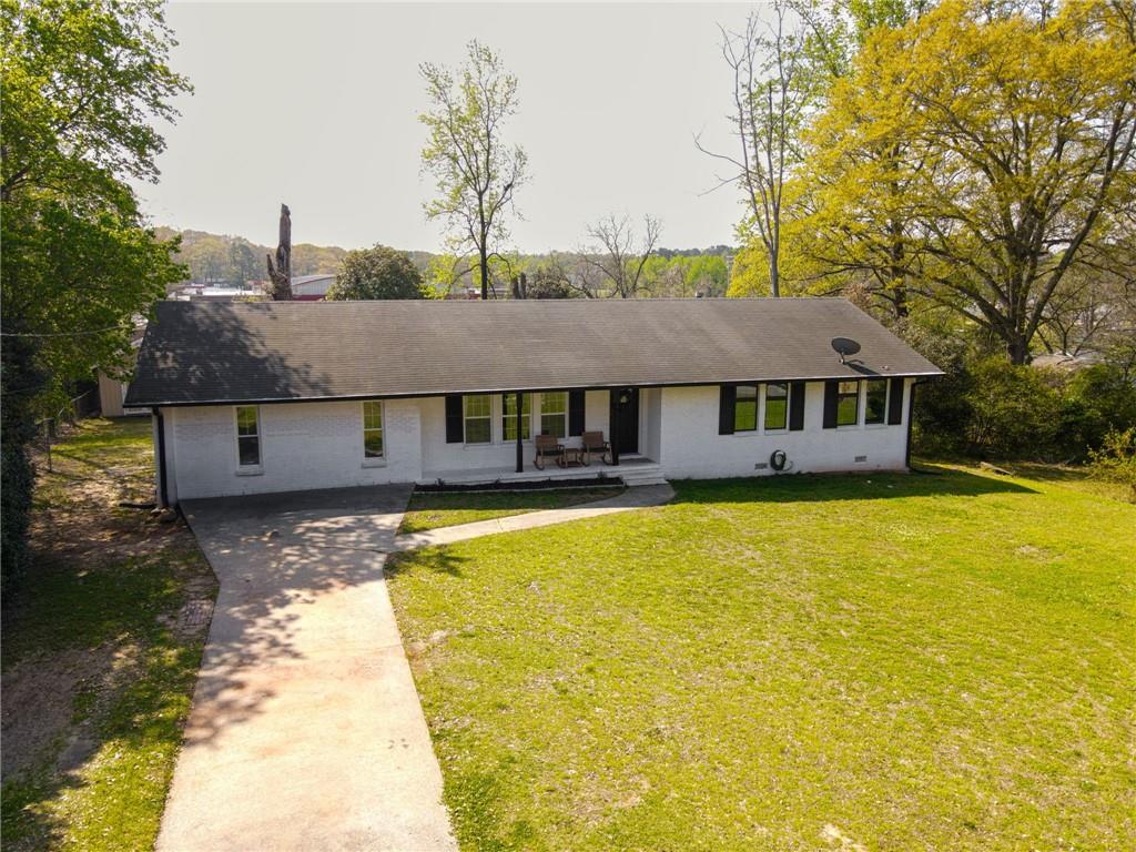 150 Sims Street Winder, GA 30680 - Photo 47 of 61 a front view of house with swimming pool
