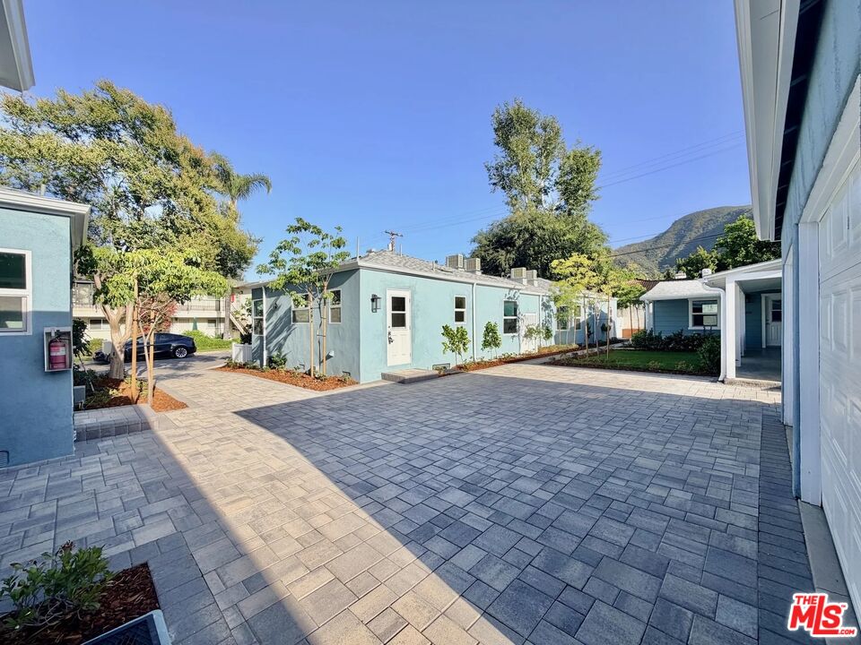 2924 West Riverside Drive Burbank, CA 91505 - Photo 13 of 15 a street view with a building and trees in the background