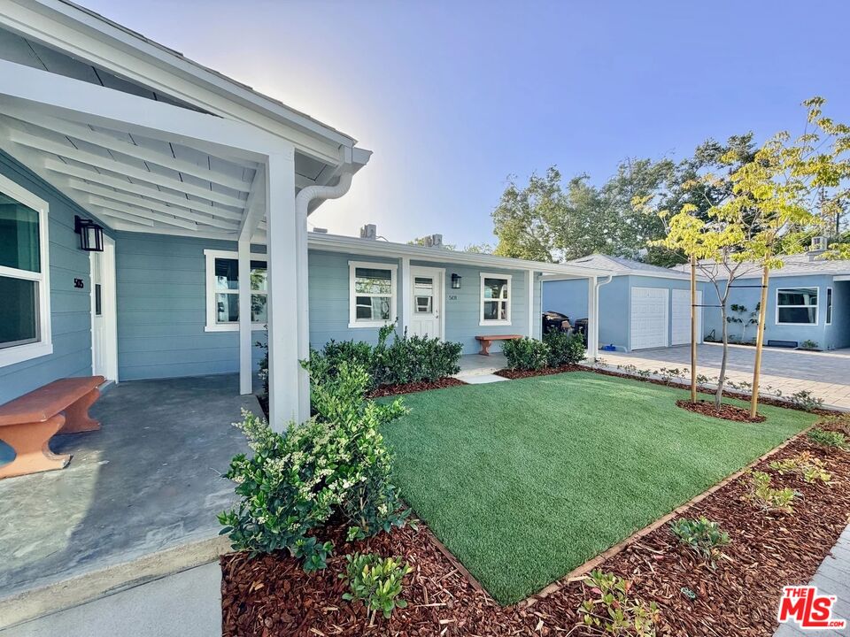 2924 West Riverside Drive Burbank, CA 91505 - Photo 15 of 15 a front view of a house with a yard and porch