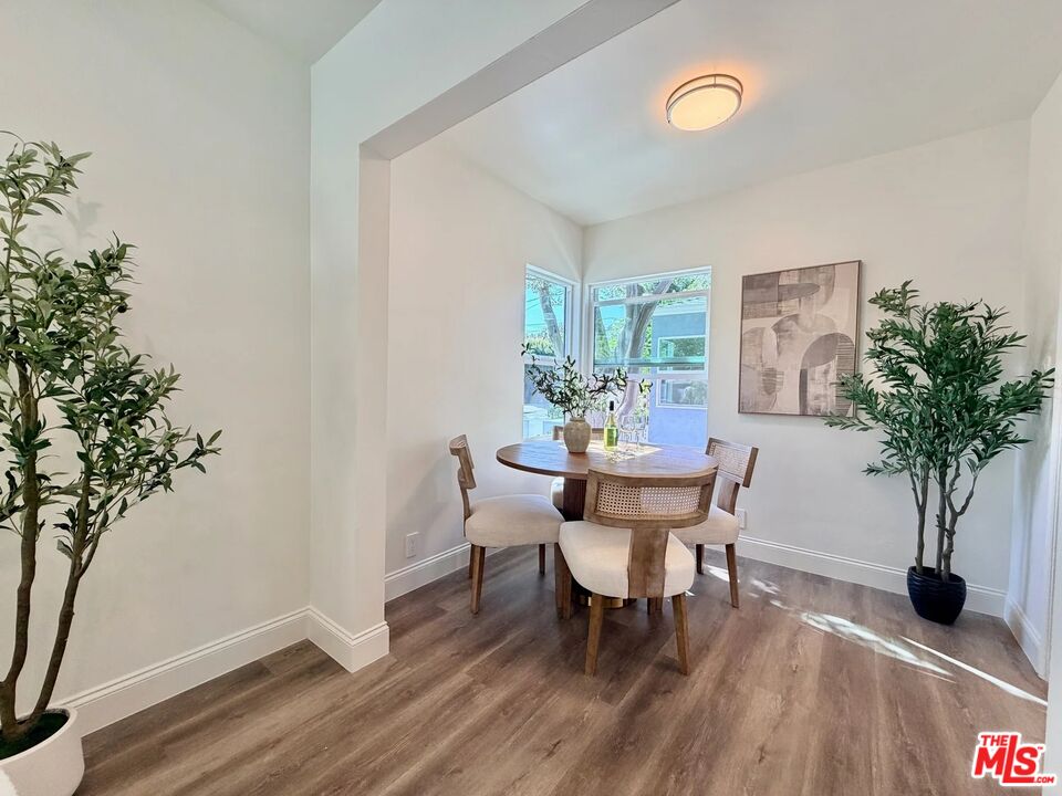 2924 West Riverside Drive Burbank, CA 91505 - Photo 3 of 15 a view of a dining room with furniture and wooden floor