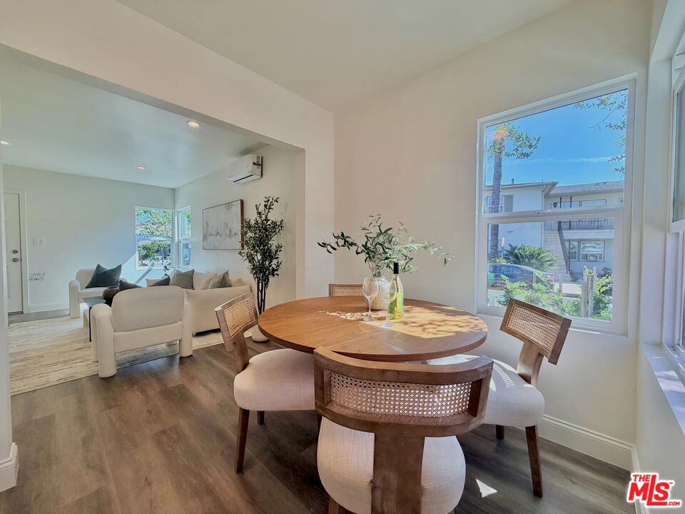 2924 West Riverside Drive Burbank, CA 91505 - Photo 4 of 15 a dining room with furniture wooden floor and a chandelier