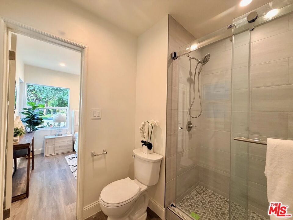 2924 West Riverside Drive Burbank, CA 91505 - Photo 8 of 15 a bathroom with a shower and a toilet